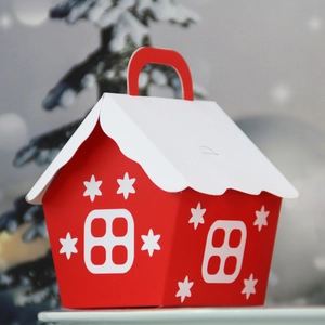 European Christmas house-shaped gift box in red with snowflake patterns and handle