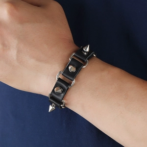 Men's punk leather bracelet featuring silver metal spikes and D-ring charms on black leather