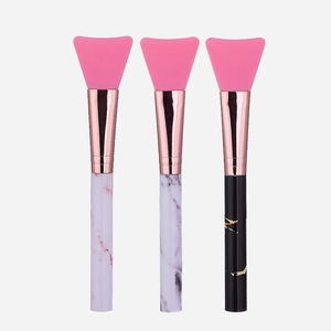 Three-piece marble pattern silicone mask brush set with pink fan-shaped heads and rose gold tubes