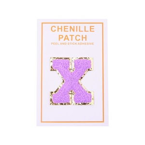 Detail of a purple chenille letter X patch with gold glitter edges and adhesive backing