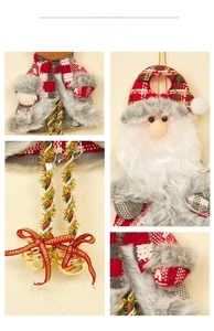 Detail of Christmas Santa hanging ornament with fabric plaid and golden bells