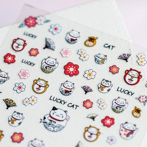 Lucky cat theme 5D thin nail art stickers featuring cherry blossoms and fortune bags