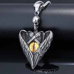Detailed view of gothic skull and angel wing pendant with a yellow dragon eye stone