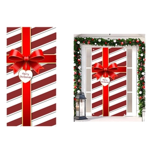 Red and white candy cane Christmas door cover with a large bow and Merry Christmas sign
