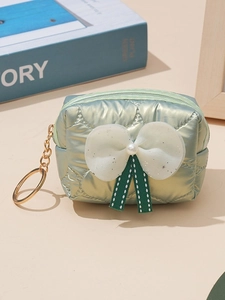 Light green quilted mini bow pouch with pearl detail and gold keychain for lipstick