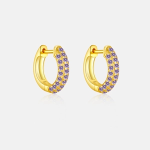 Detail of 925 sterling silver huggie earrings with gold finish and double-row purple zircons