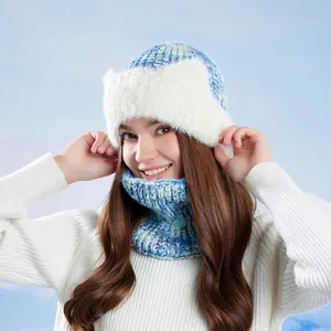 Winter knitted hat and neck gaiter set with white faux fur trim in blue and white knit