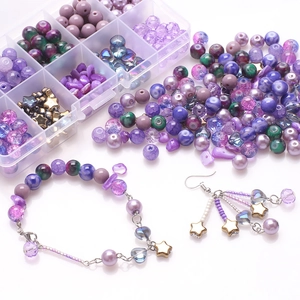 DIY jewelry kit with purple cracked glass beads and gold charms in a 10-slot storage box