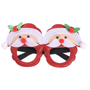 Festive red glitter Christmas glasses frame with decorative Santa Claus character toppers