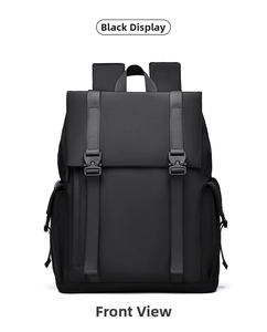 Front view of black waterproof nylon backpack with decorative straps and buckles