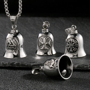 Detailed relief of Viking guardian bells with cross and wings on black slate texture
