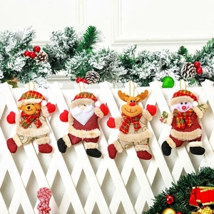 Hanging Christmas plush ornaments featuring Santa, reindeer, snowman and bear characters