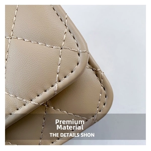 Macro detail of high-quality quilted stitching on khaki faux leather small square bag