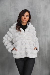 Detailed macro view of light gray faux fur texture and striped panel design on jacket