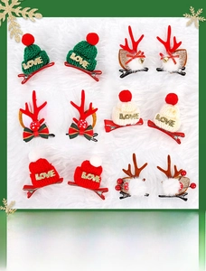 Detail of Christmas reindeer antler hair clips with bells and knitted love mini hats