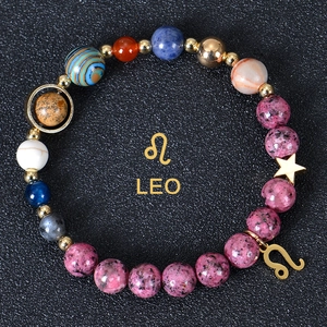 Macro detail of 8mm beaded Leo zodiac bracelet with blue stones and star charm