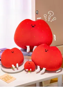 Detail showing plush strawberry pillows in four sizes with cute facial embroidery