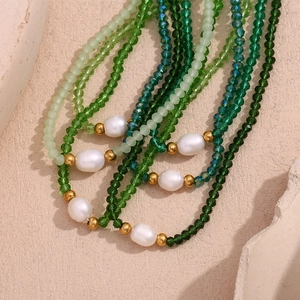 Multilayer mint green crystal beads and freshwater pearl necklace with gold accents