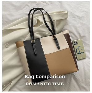 Detailansicht einer großen Patchwork-Tasche in Schwarz, Beige und Karamell mit Riemen