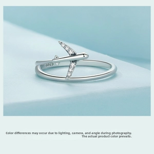 Detailed macro view of S925 sterling silver airplane ring with sparkling white zircons