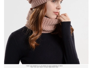 Close-up of pink cable knit winter hat and neck warmer set with warm fleece lining