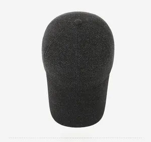 Overhead detail view of thick dark grey wool baseball cap with textured PAPARD embroidery