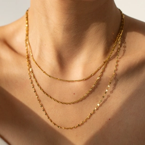 Three-layer layered gold titanium steel necklaces with twisted and flat chain designs