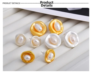 Macro view of French baroque pearl earrings with irregular gold liquid metal texture