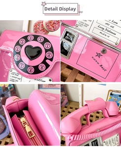 Detail view of pink retro telephone bag with dial-pad décor and glossy patent finish