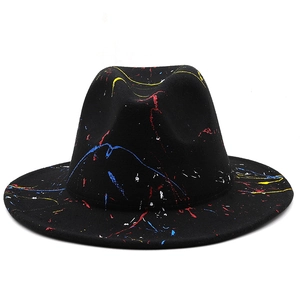 Close-up of black felt fedora hat with colorful artistic graffiti spray paint details