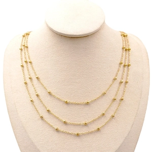 Three-layer gold titanium steel necklace with spaced beads on elegant choker chains