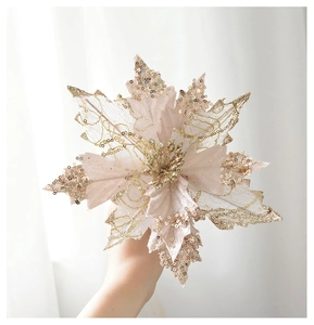 Close-up of champagne glitter Christmas flower with golden stamens and velvet lace petals