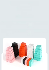 Detailed stack of multi-colored drawer gift boxes with pull tabs for jewelry packaging