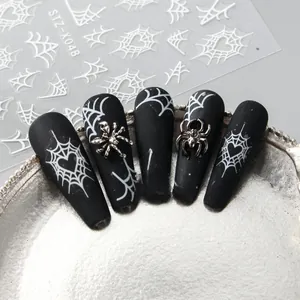 Macro view of Halloween nail art stickers with spider web and heart patterns STZ-X048