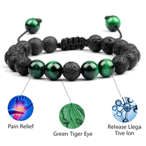 Detail of adjustable braided bracelet with green tiger eye and black lava stones