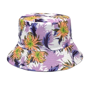 Close-up of purple floral pattern and daisy print on double-sided sun bucket hat