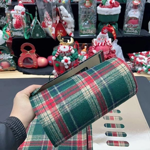 Classic red and green Christmas plaid fabric roll for elegant floral gift wrapping
