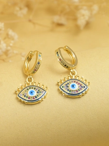 Detailed macro view of gold evil eye hoop earrings with colorful zircon stone settings
