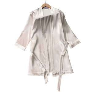 Elegant solid white satin bathrobe with a waist tie, showcased on a wooden hanger