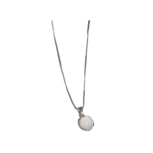 Minimalist silver chain necklace featuring a round opal pendant with sleek metal edge
