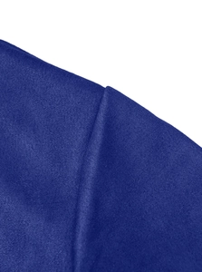 Macro shot of dark blue knitted fabric texture and fine stitching on the heavy jacket
