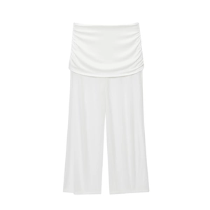 Detail of high-waist white wide-leg pants with elegant pleated folding waist design