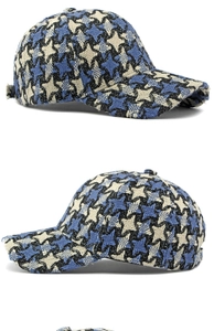 Detailed side view of houndstooth wool baseball cap in blue black and beige