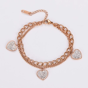 Detailed view of triple-layered rose gold heart bracelet with micro-pave white zircon
