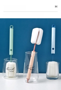 Detail of hanging porous sponge cup brushes in three colors for deep bottle cleaning