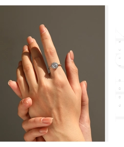 Close-up of S925 silver hexagonal ring with a round center stone and pave diamonds