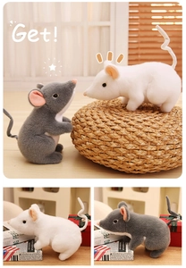 Detail view of plush mouse toys in white and grey colors with soft velvet texture