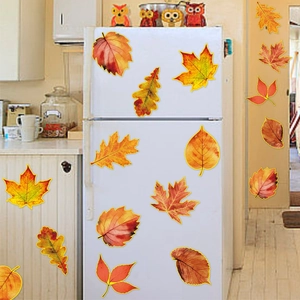 Vibrant autumn maple leaf decals on white refrigerator and wall for Thanksgiving decor