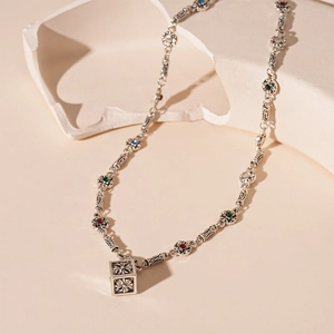 Vintage silver cube necklace with colorful stones and intricate floral patterns