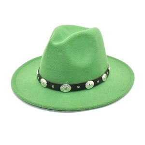 Detail of green wool fedora hat featuring black leather band and silver metal studs